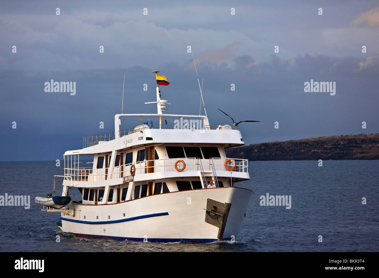 Galapagos Islands, The motor yacht Galapagos Voyager arrives off Genovese. Stock Photo
