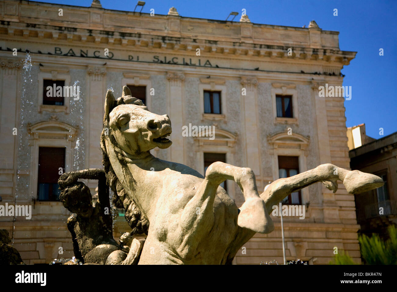 Italy, Sicily, Siracuse, Ortygia; A sculpture of a horse, part of the fountain in a square in Ortygia Stock Photo
