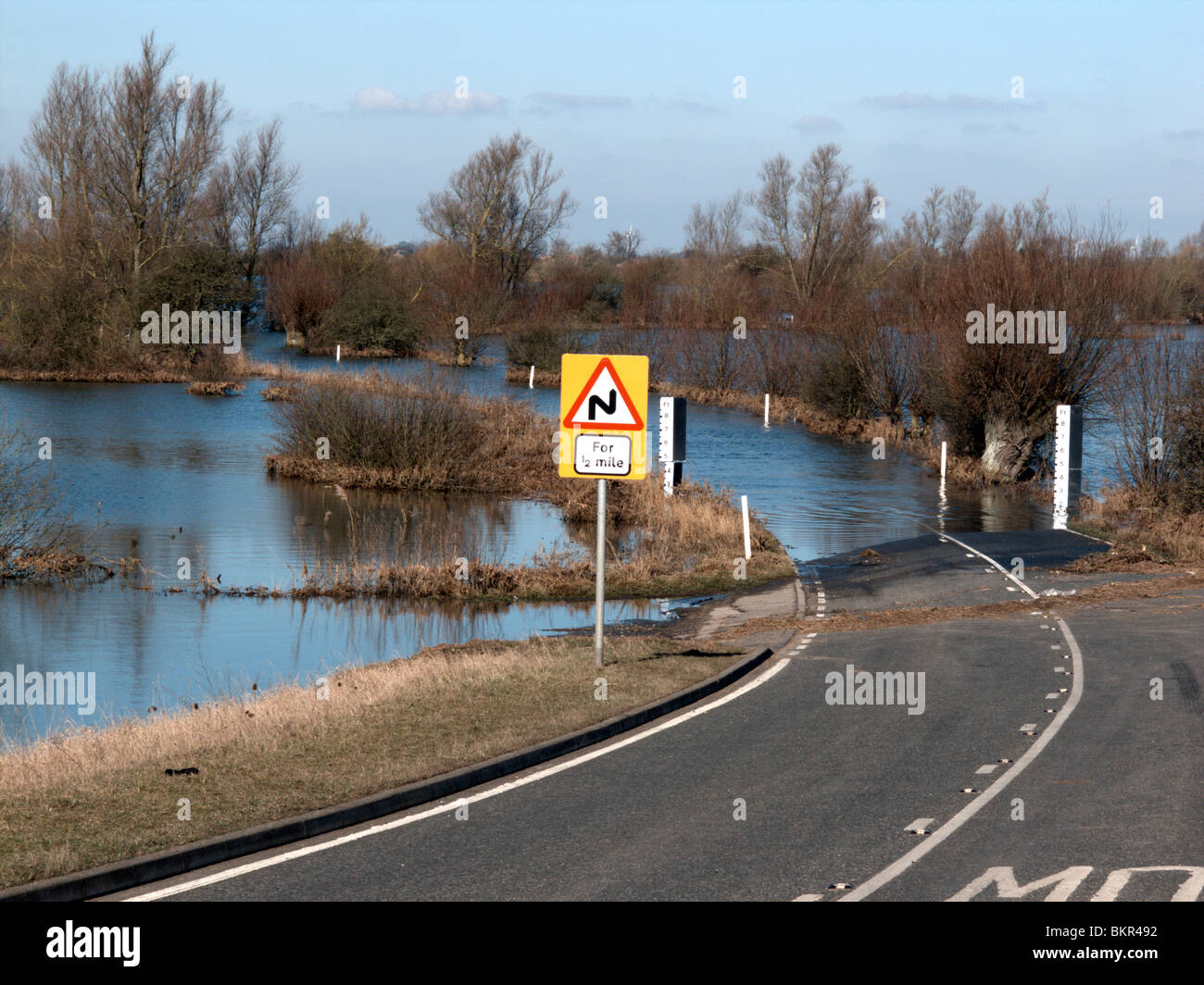 Welney, Old Bedford River and New Bedford River floods blocking the road to the village of Welney. Stock Photo