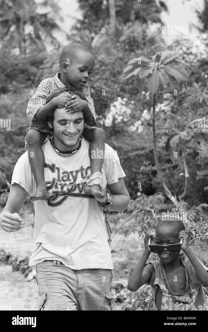 Volunteers playing with local children, Mombasa, Kenya Stock Photo