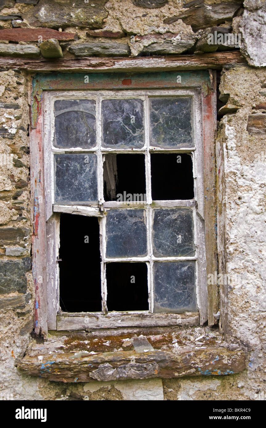 broken-window-in-derelict-cottage-BKR4C9