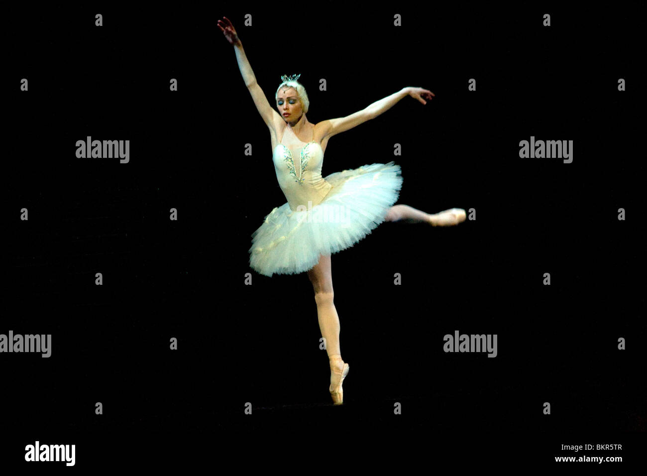 Russia, St.Petersburg; The Prima Ballerina playing the Swan Princess Odette during a solo in Tchaikovsky's 'Swan Lake' Stock Photo