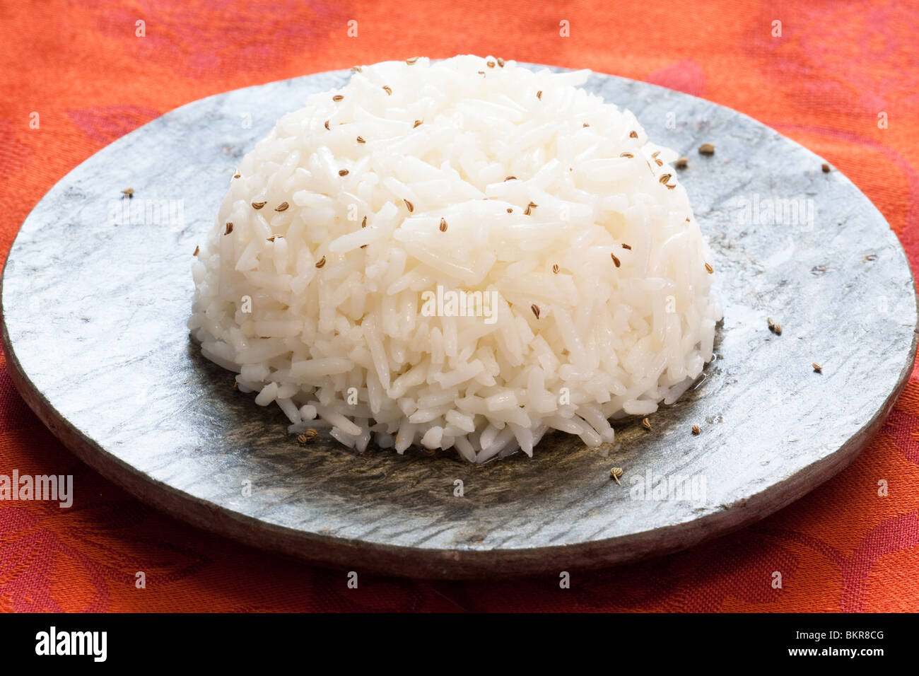 Single serving of steamed rice topped with cumin. A very popular side