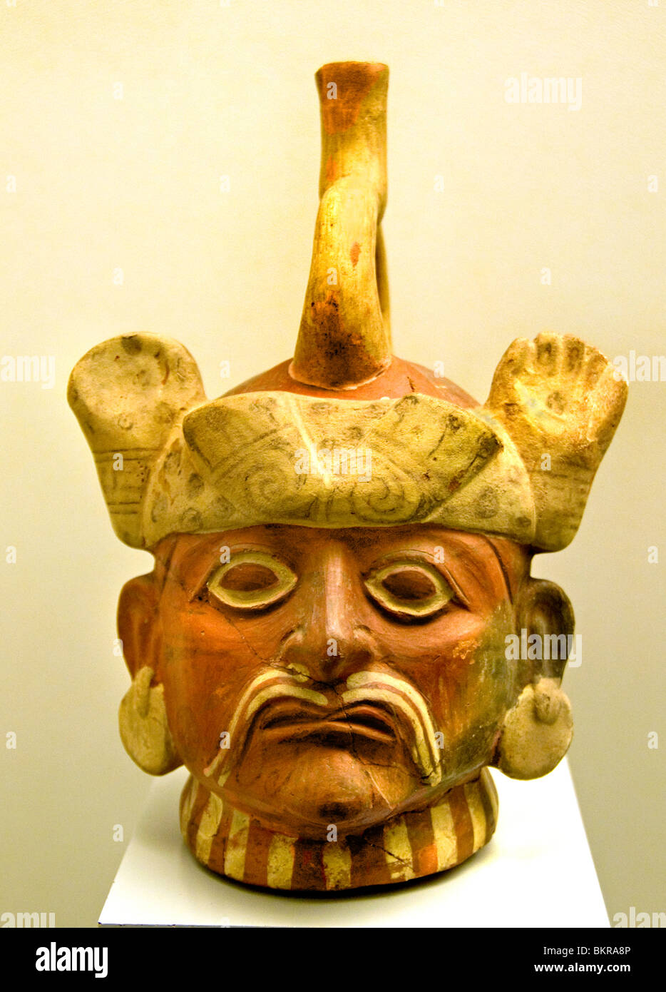 Great Lord as indicated by his headdress of feline claws, his large ear flaps and his face paint,  Moche or Mochica 100 AD - 700 AD. Peru Peruvian. Stock Photo