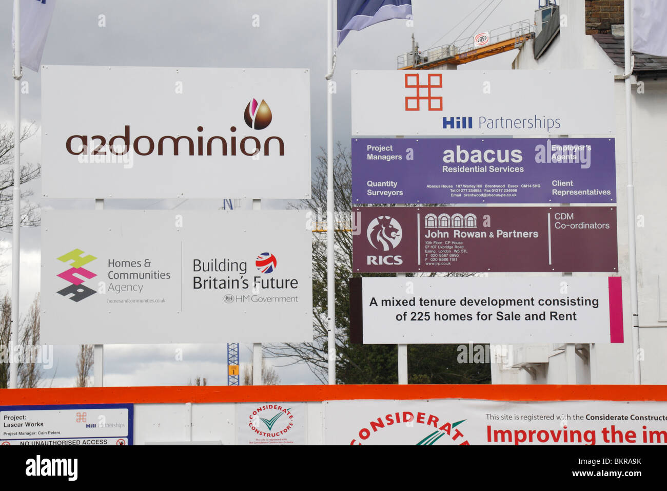 Mixed hoardings outside a construction site showing the developer, contractor, architects and others. Hounslow, UK May 2010 Stock Photo