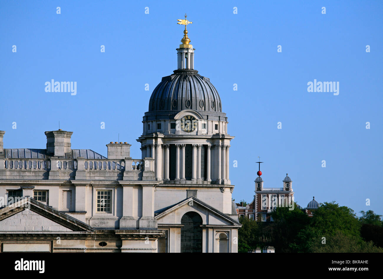 The west wing of Wren's masterpiece, the dome and clock of the Royal Naval College with the Royal Observatory behind. Stock Photo