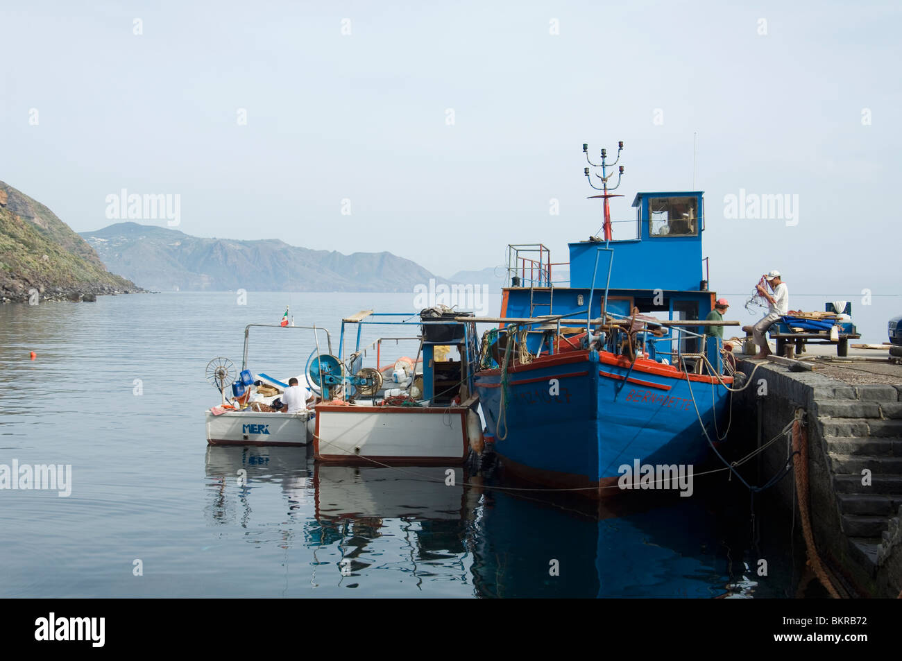 Fishermen and boats at the port of Rinella on the island of  Salina - Aeolian Islands Stock Photo