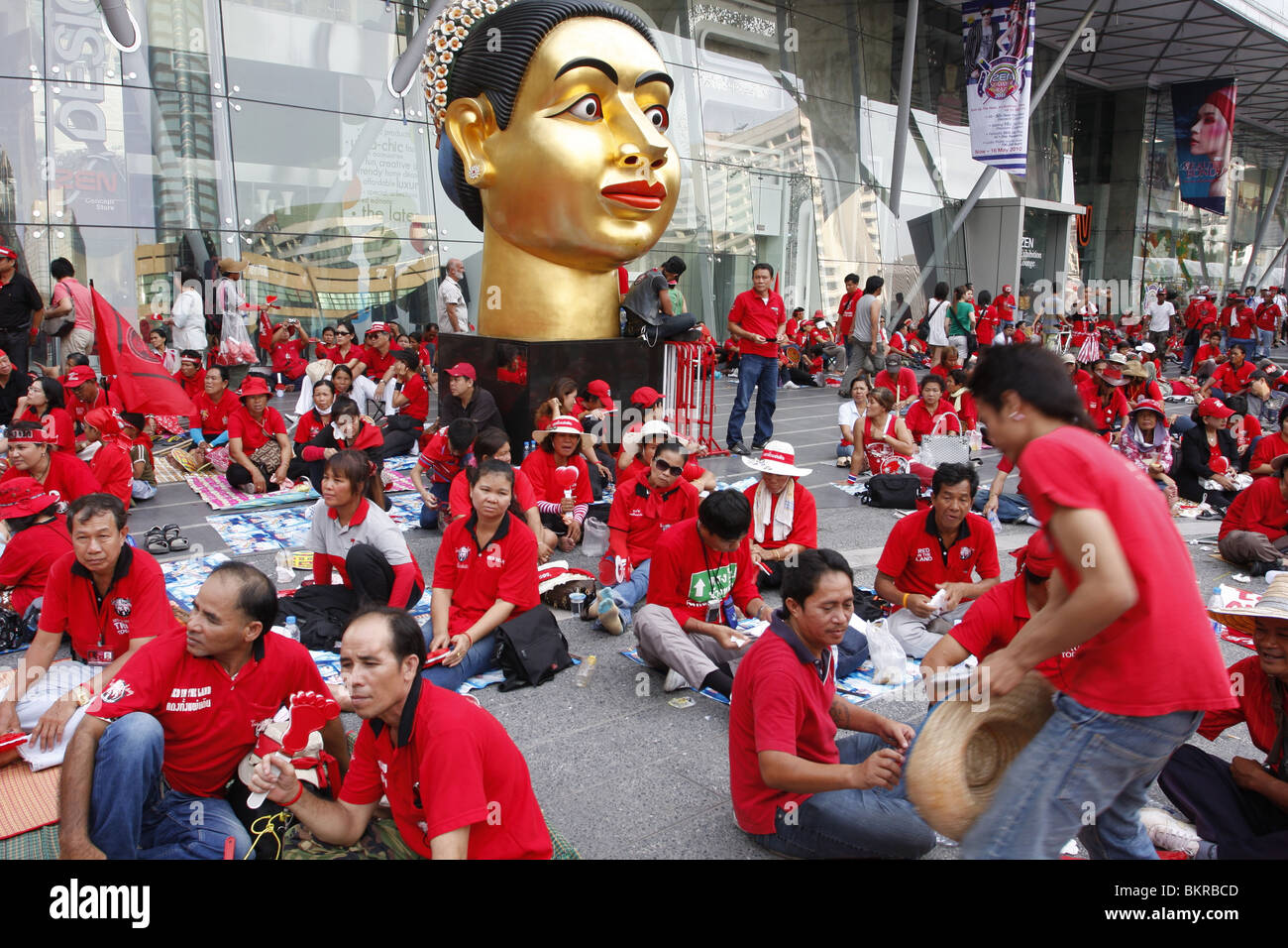 Red shirt demonstrators campaigning against the government in front of Central World shopping center in central Bangkok. Stock Photo