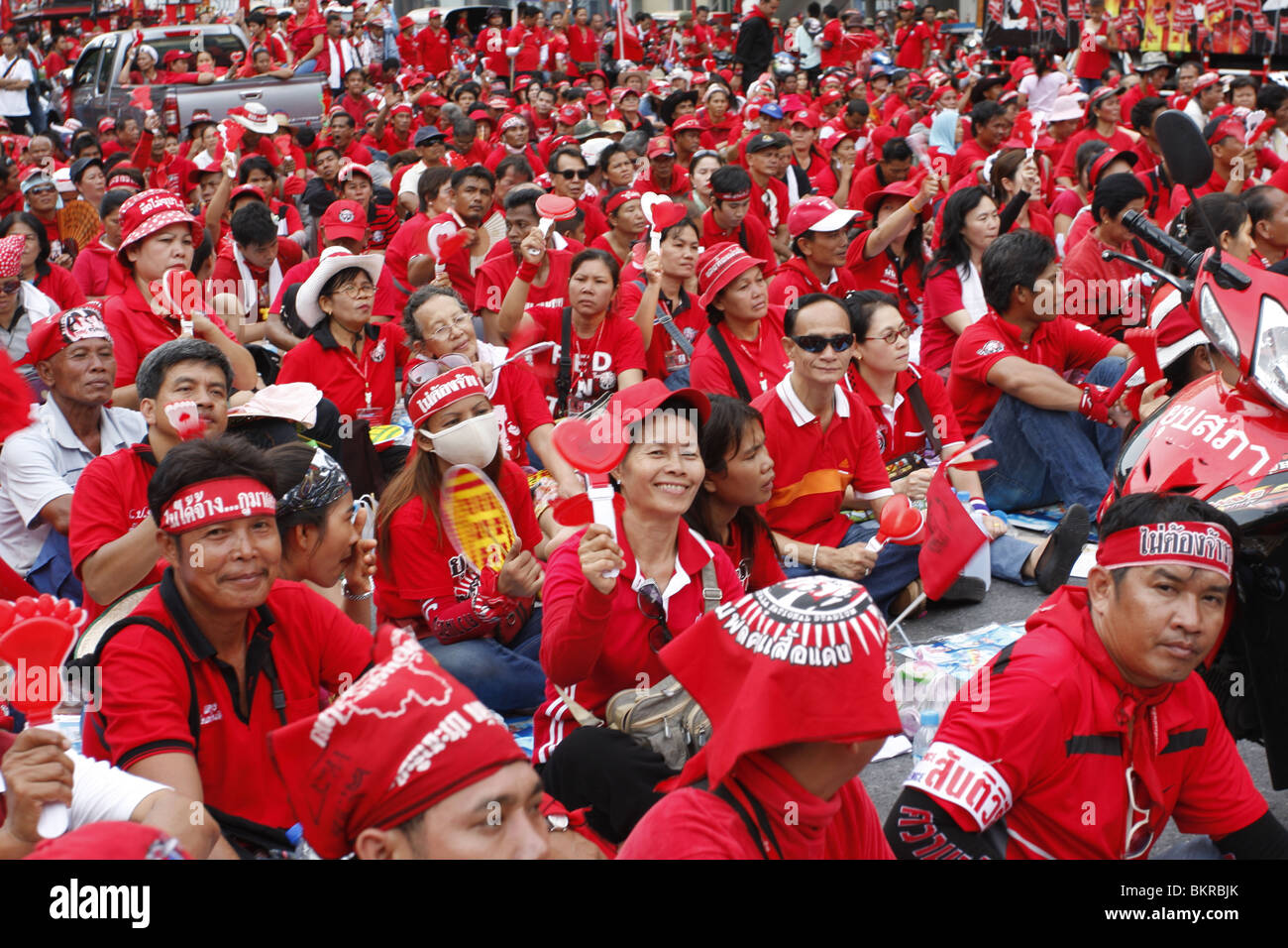 Red shirt demonstrators campaigning for the return of disgraced PM Thaksin Shinawatra, in central Bangkok. Stock Photo