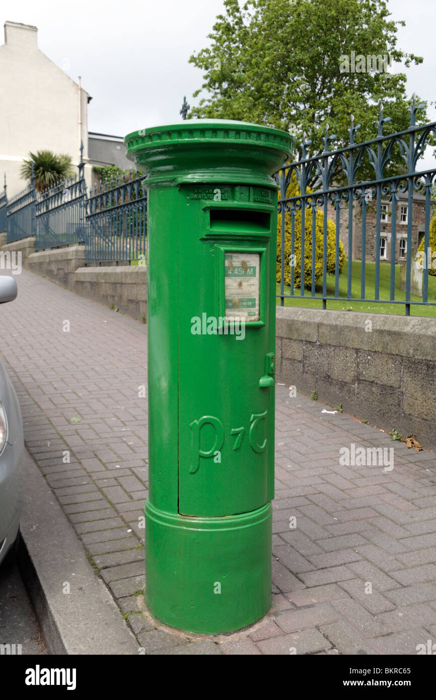 A traditional green post box in Enniscorthy, Republic of Ireland Stock