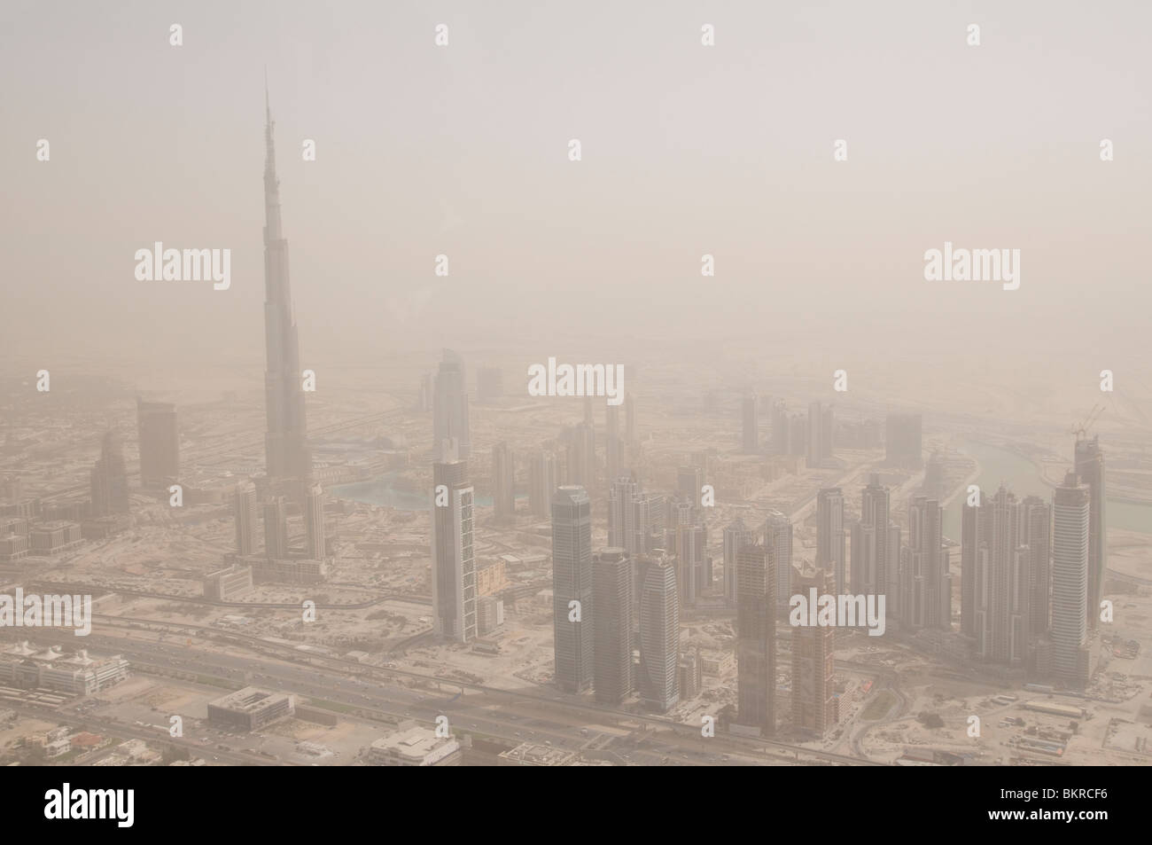 Dubai with the Burj Dubai, the worlds tallest building on the far left UAE during a sandstorm Stock Photo