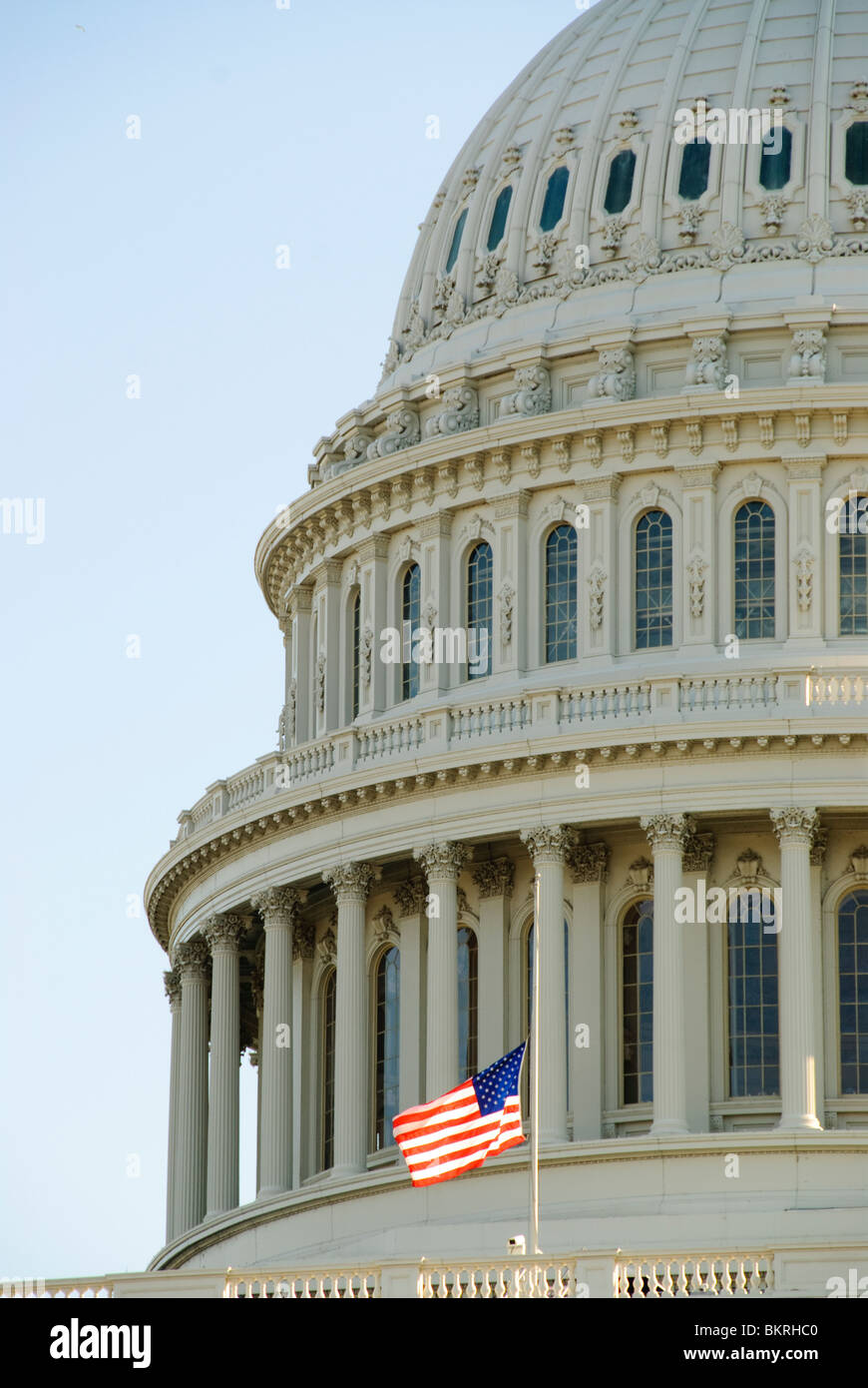 Dome of the US Capitol, with backlit American flag at half mast Stock ...