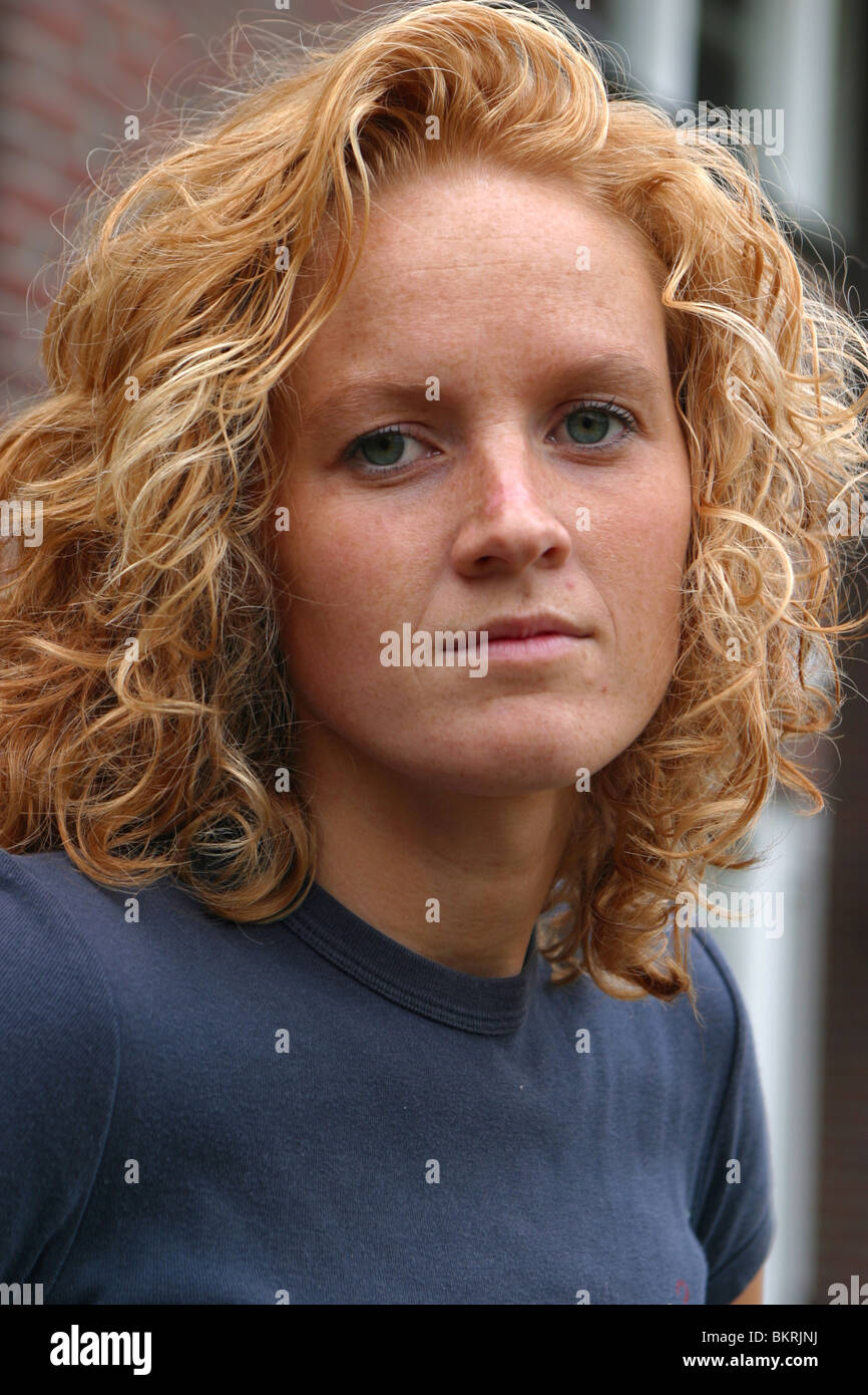 Hair red close up, natural woman looking at camera serious face Stock Photo