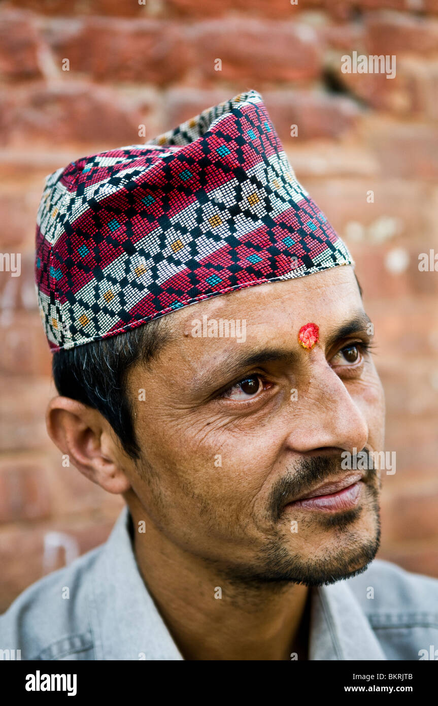 Portrait of a Nepali man wearing a traditional hat. Stock Photo