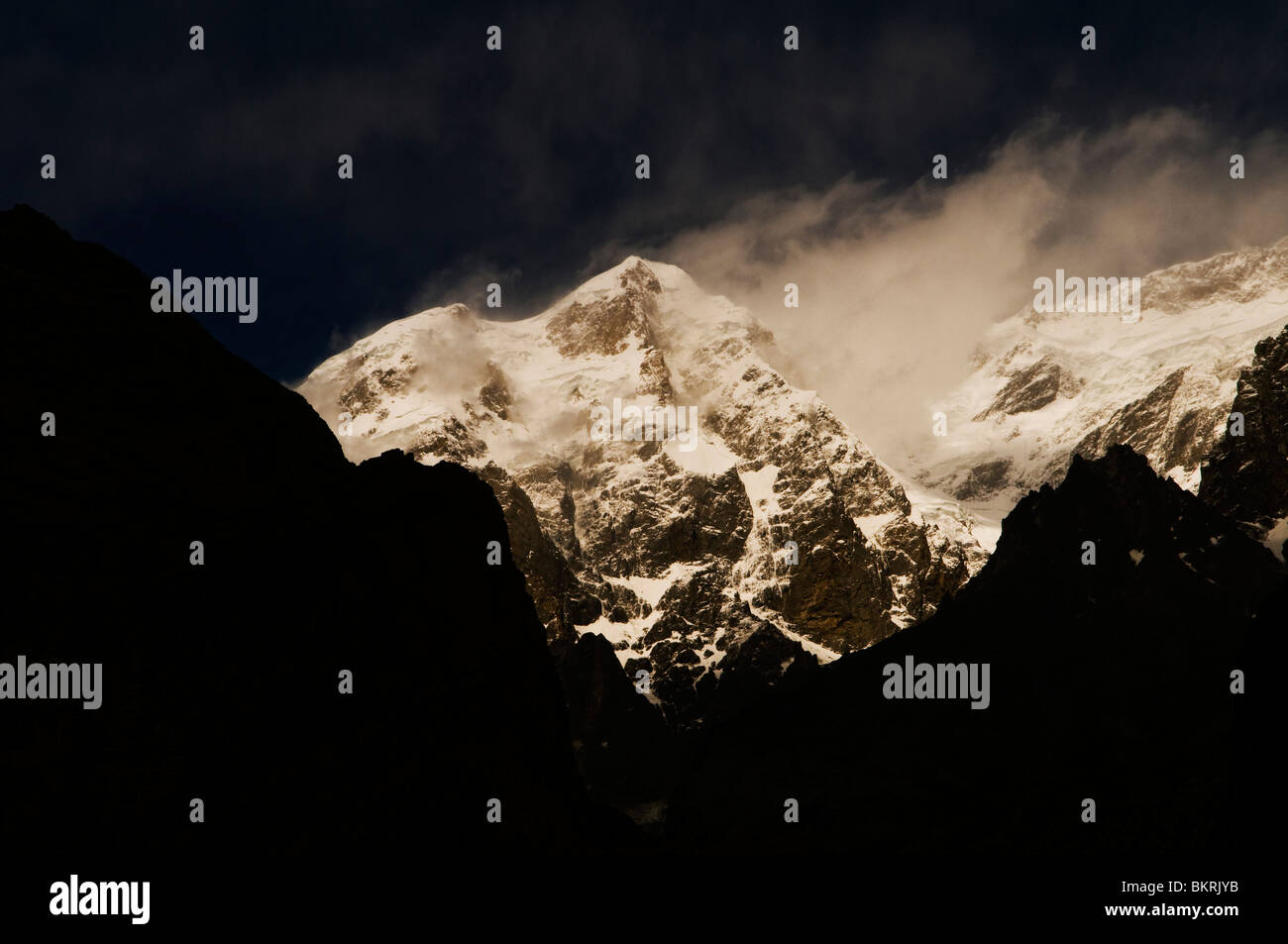 Ultar Sar peak is the south easternmost major peak of the Batura Muztagh, a subrange of the Karakoram  range in Pakistan. Stock Photo
