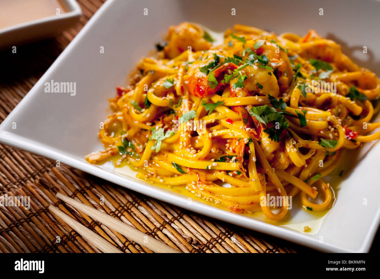 Chinese noodles with shrimp on a bamboo mat Stock Photo