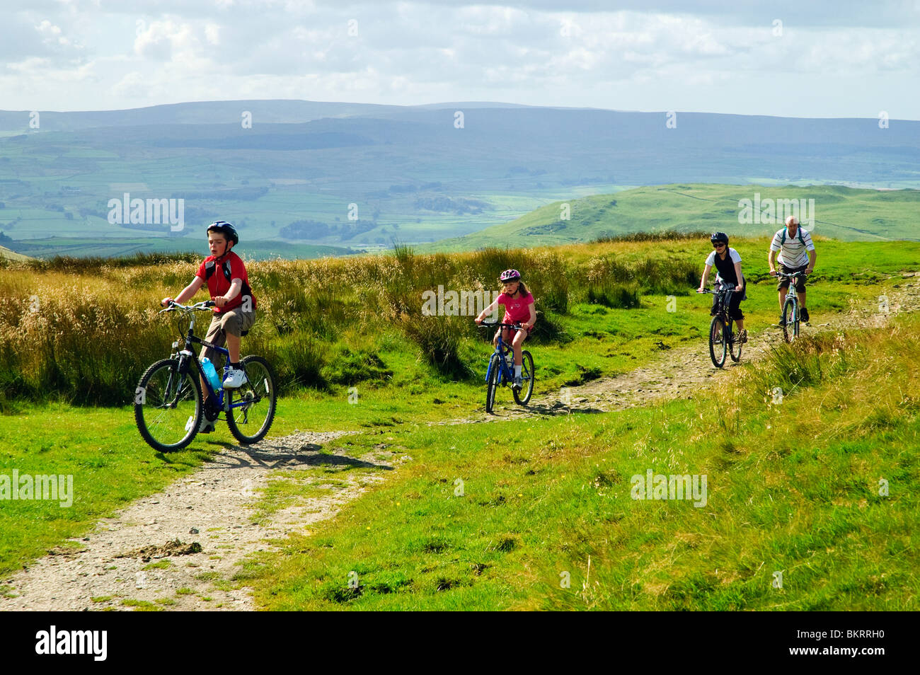Family group on mountain bikes on Stockdale Lane near Settle, part of