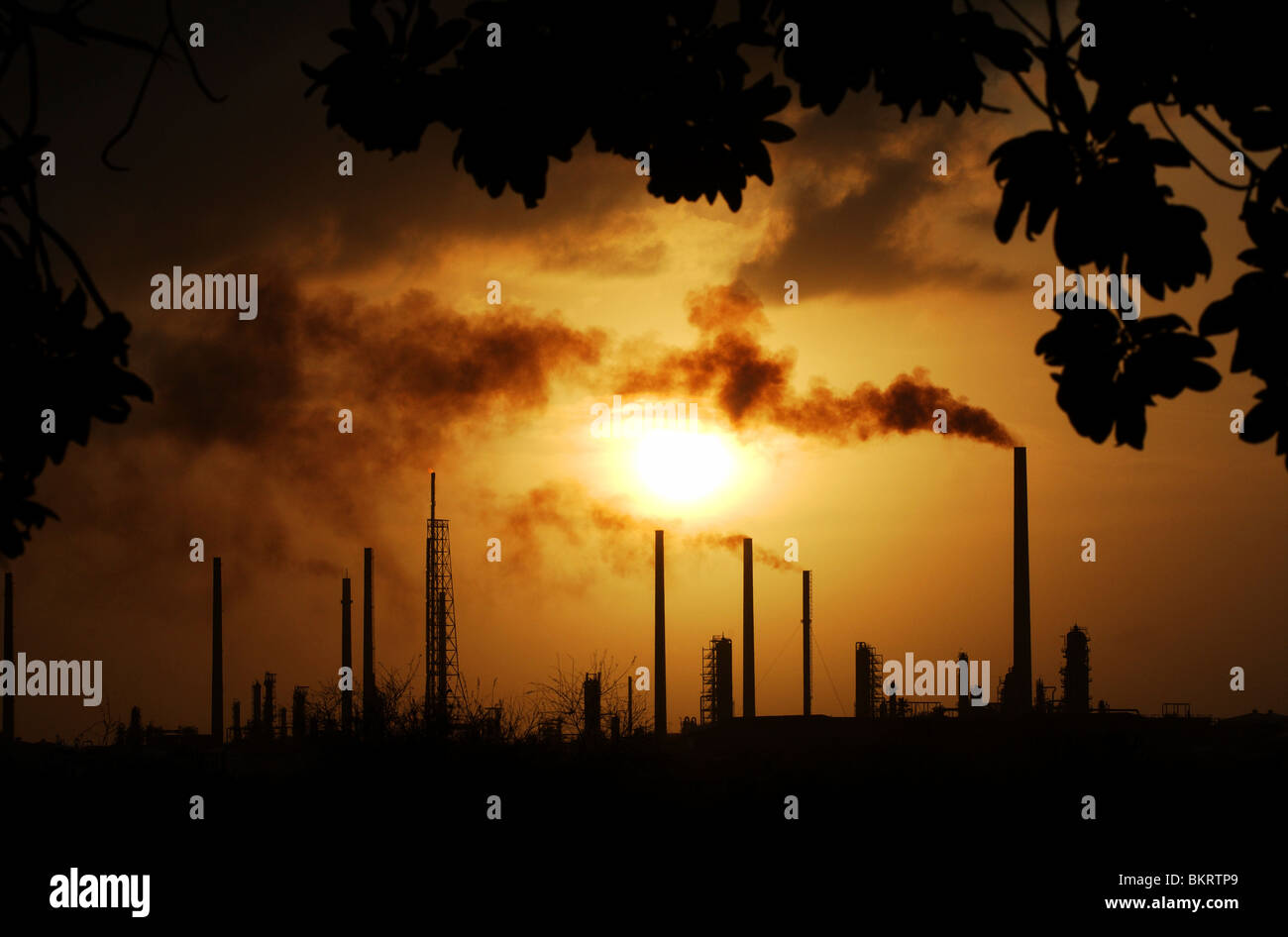 Carribbean, Winward Islands, Lesser Antilles, Dutch Antilles, Curacao, Willemstad, the La Isla oil Refinery at sunset. Stock Photo