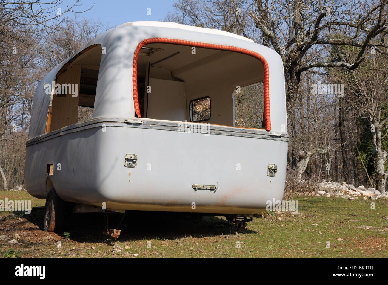 Abandoned caravan left in a field, Island Cres, Croatia Stock Photo