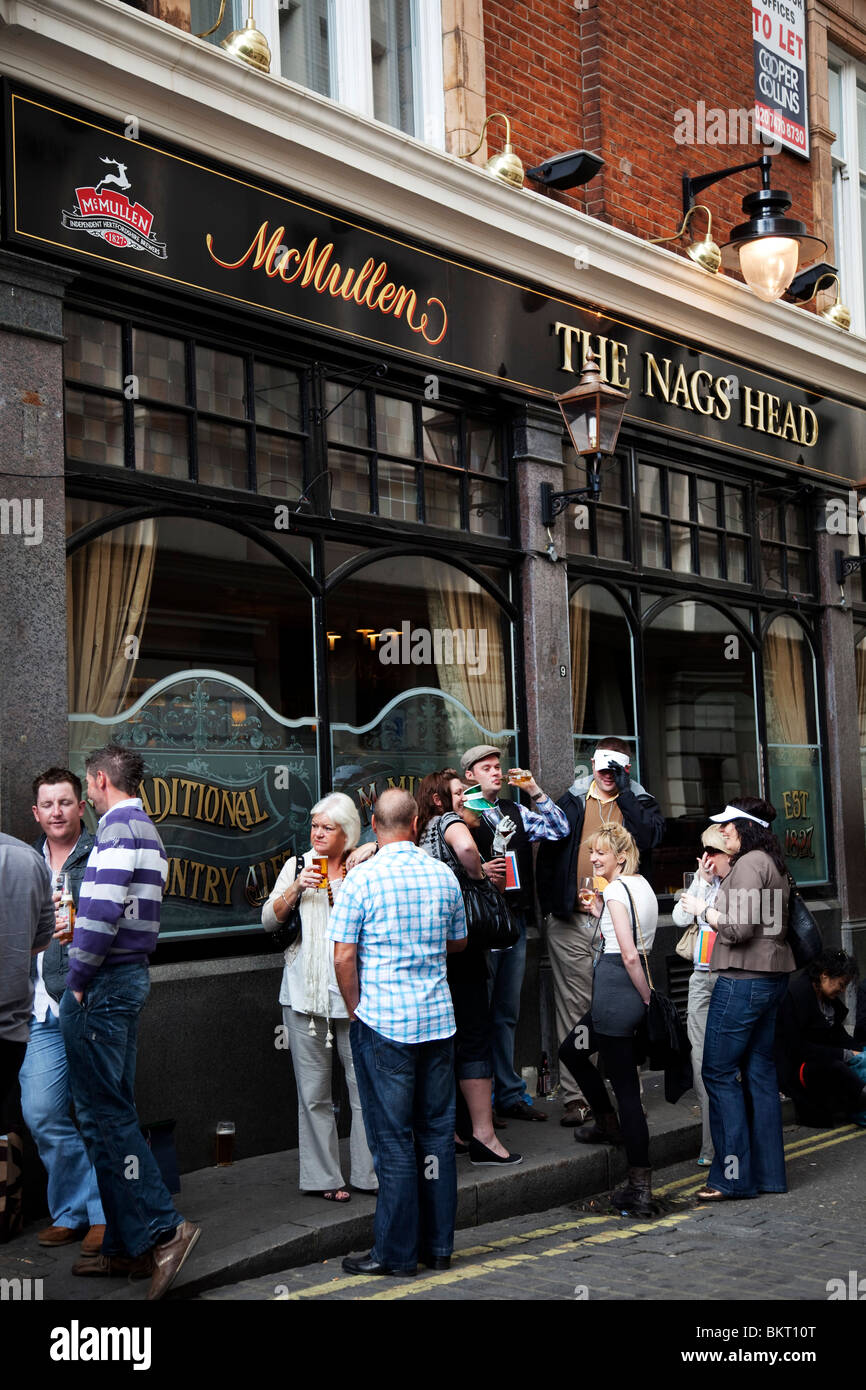 People outside the Nags Head pub. Covent Garden in the West End of London. Stock Photo