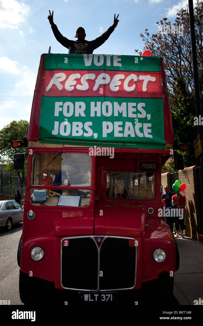 The Respect Party bus. Predominantly Muslim voters, and supporters outside a Polling Station in Whitechapel, London. Stock Photo