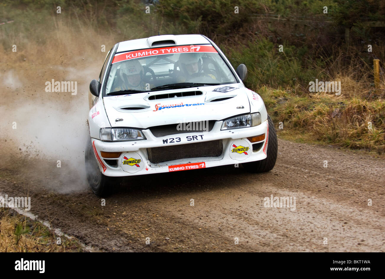 Rally car with steam coming from the wheels Stock Photo