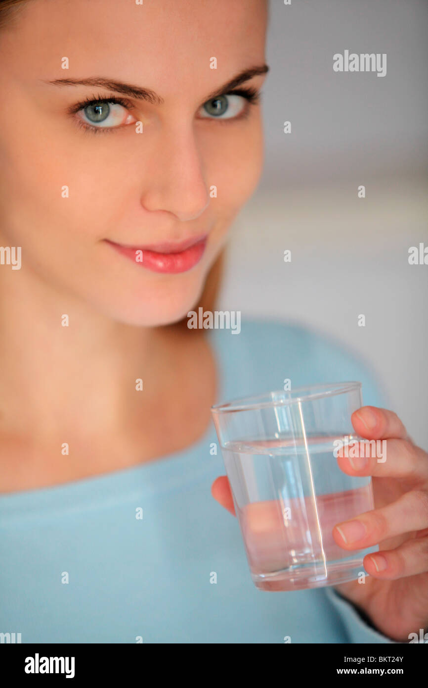 young woman drinking water Stock Photo Alamy