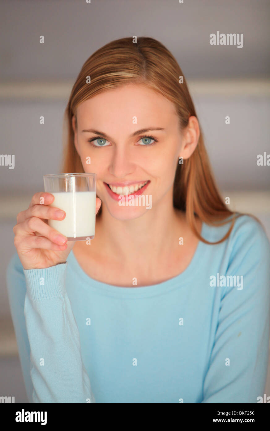 young woman drinking milk Stock Photo Alamy