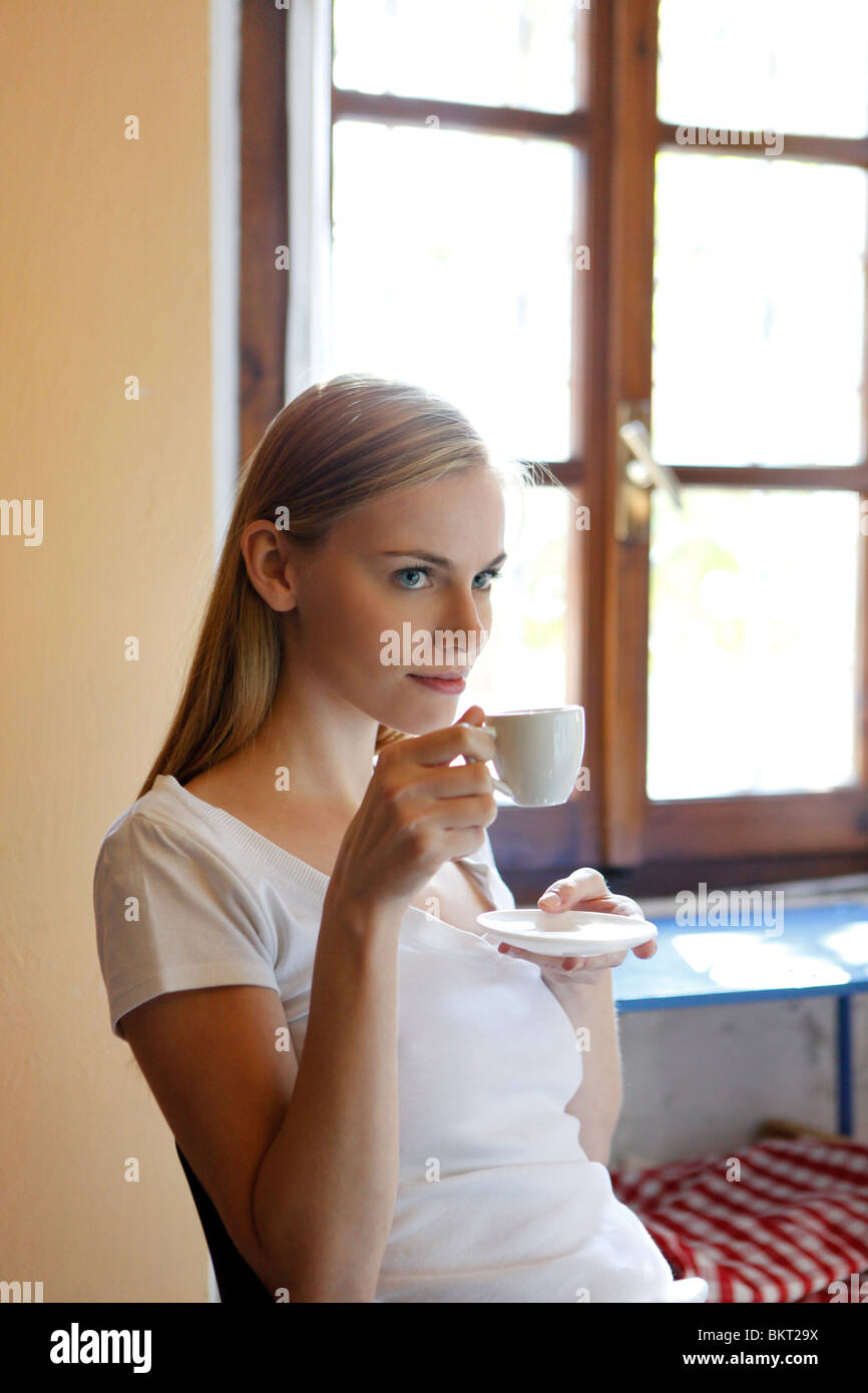 young woman drinking coffee Stock Photo