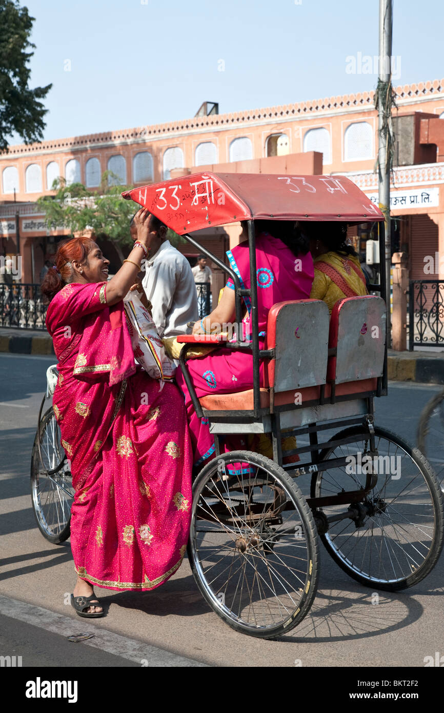 Indian women taking a cycle rickshaw. Jaipur. Rajasthan. India Stock Photo