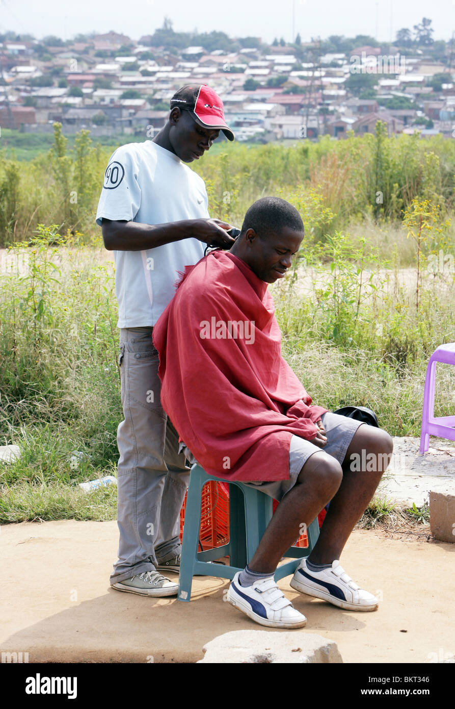 Street hairdresser in the Township Soweto, Johannesburg, South Africa Stock Photo