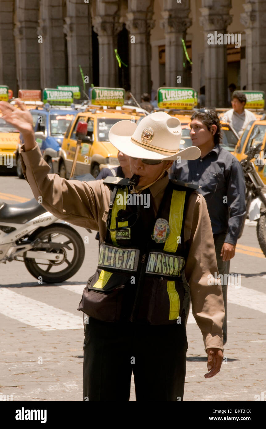 Police woman at street protest in Arequipa, Peru, by taxi drivers over rising cost of petrol Stock Photo