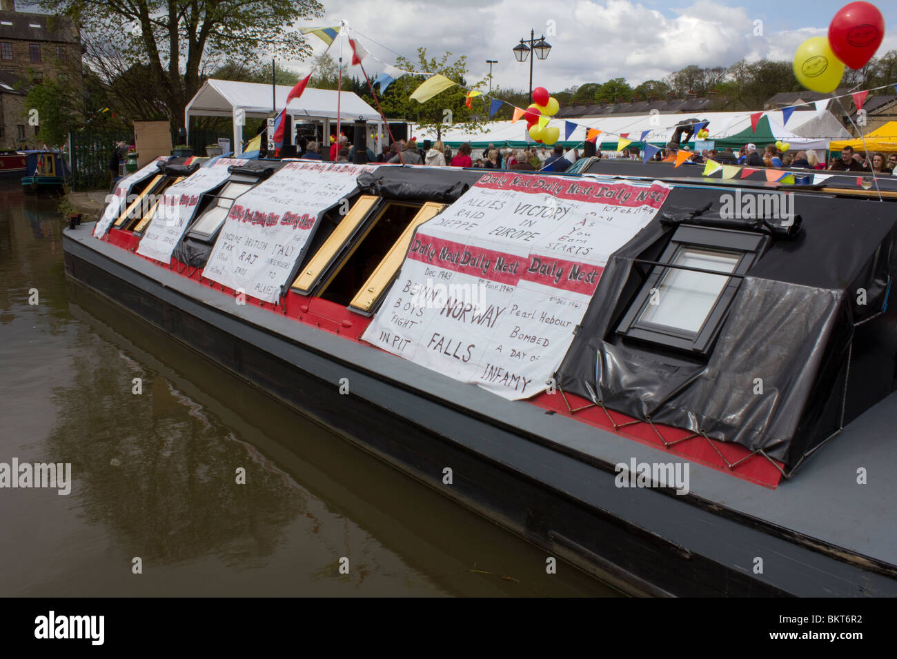 Canal Boat at Skipton Displaying Spoof War Headlines Stock Photo