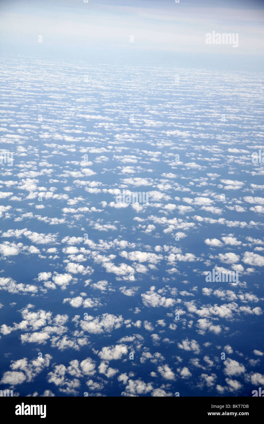 Blue sky with clouds from above Stock Photo
