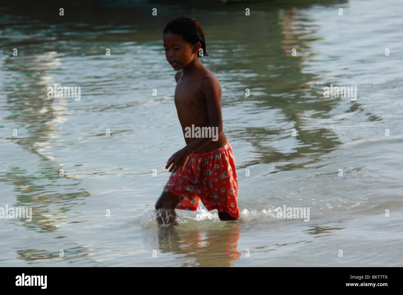 young gypsy boy , chao leh, sea gypsy village , rawai beach , phuket island ,thailand Stock Photo