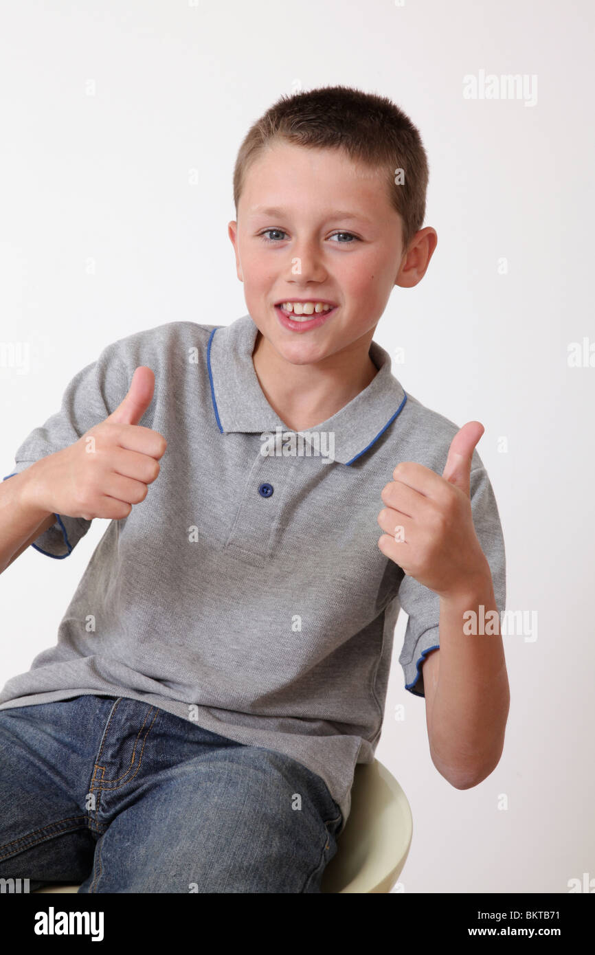 Young boy giving a thumbs up Stock Photo