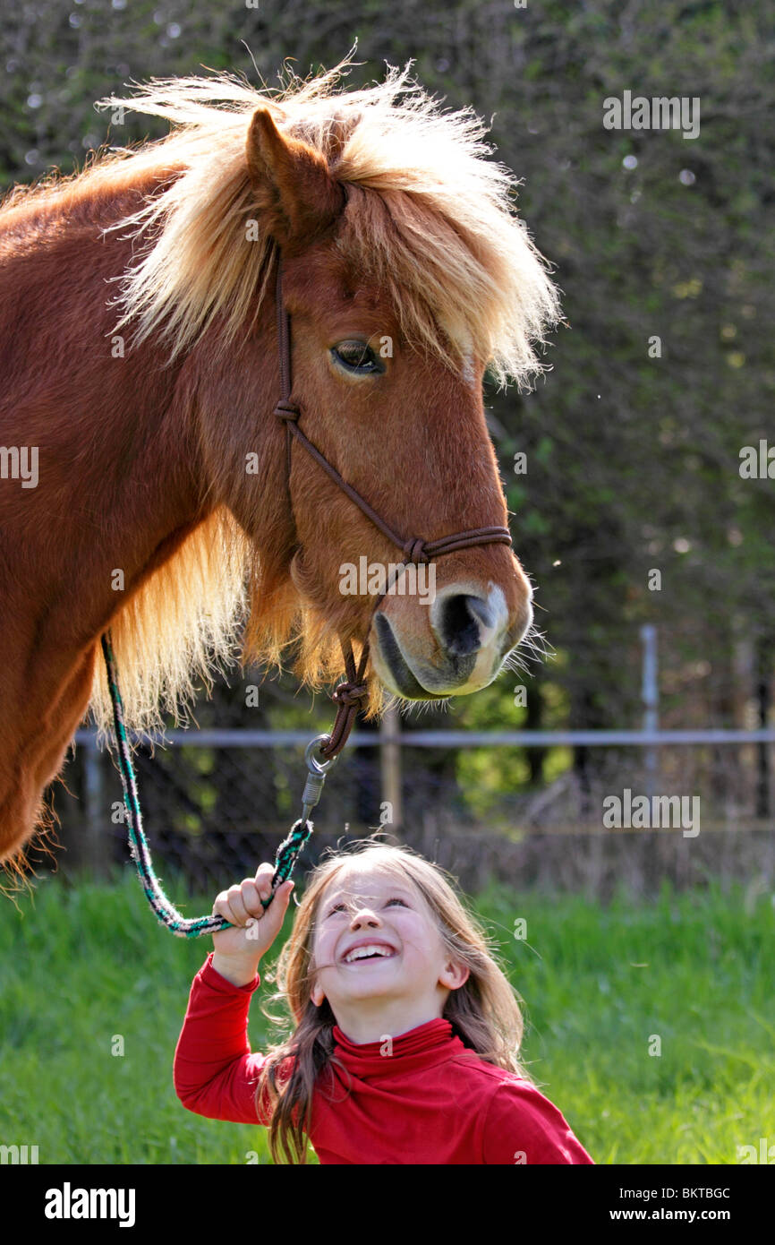 portrait of a young girl with a pony Stock Photo
