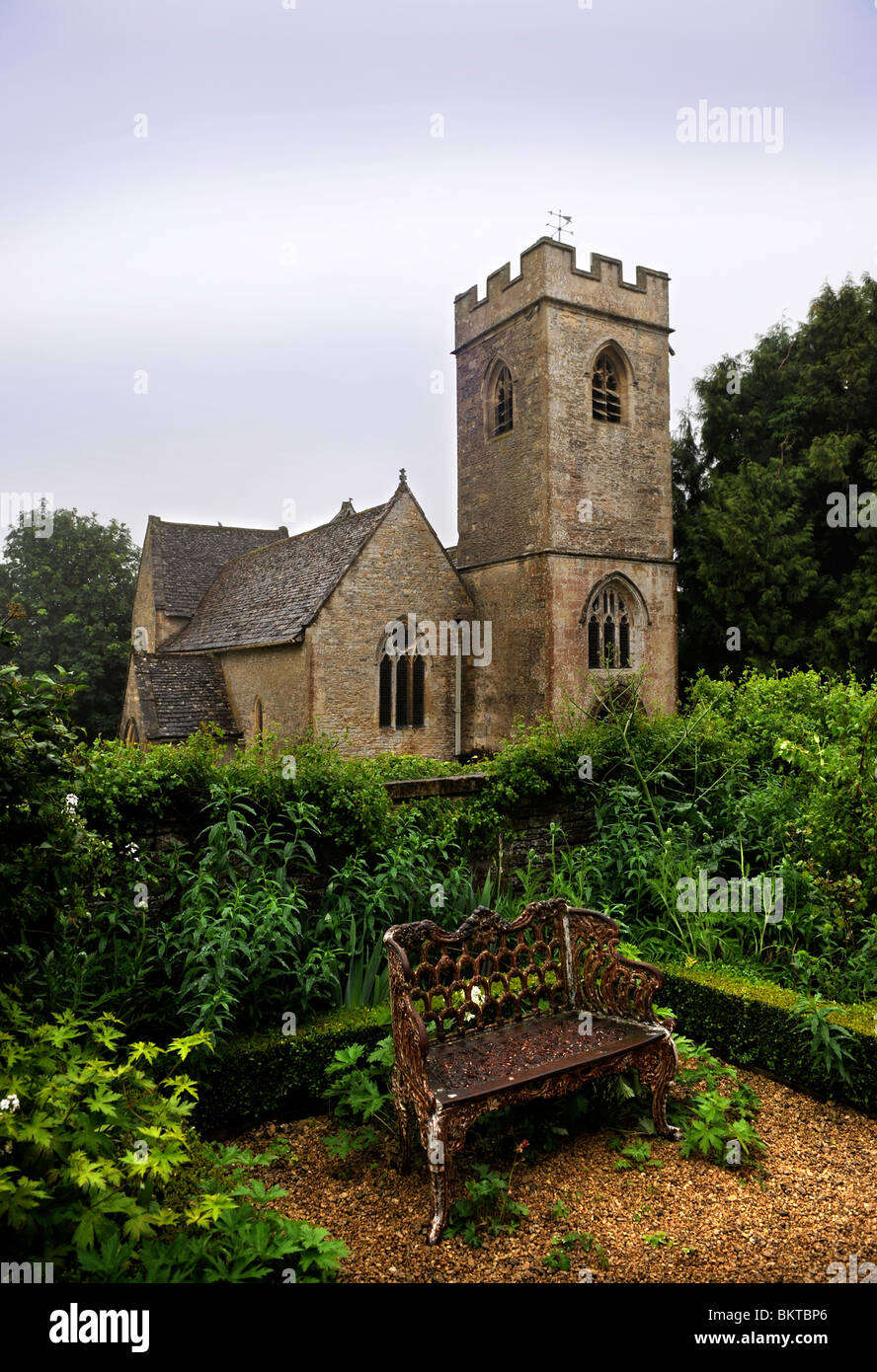 St Nicholas church in Asthall from the Manor gardens near Burford Oxfordshire May 2008 Stock Photo