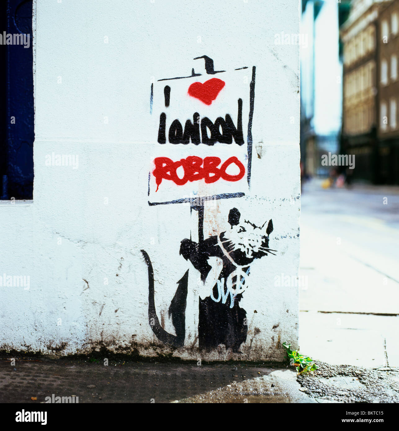 A Banksy street art stencil on a wall of a rat that once said "London doesn