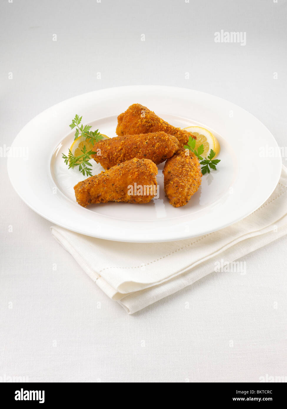Oven baked southern style breaded chicken wings hires stock