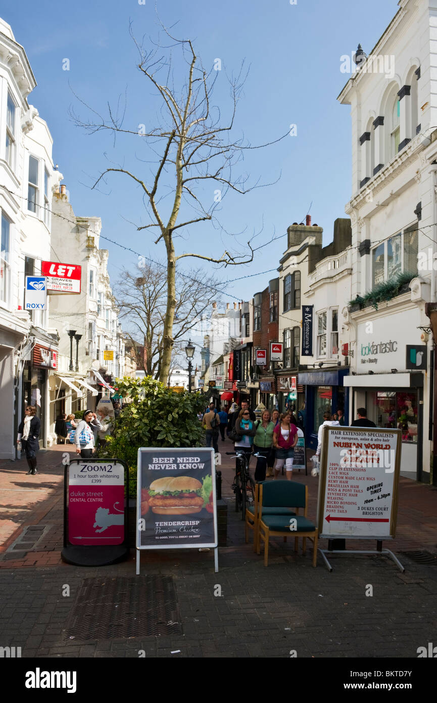 Shop signs, notices and noticeboards outside shops in the Lanes shopping area Brighton Sussex
