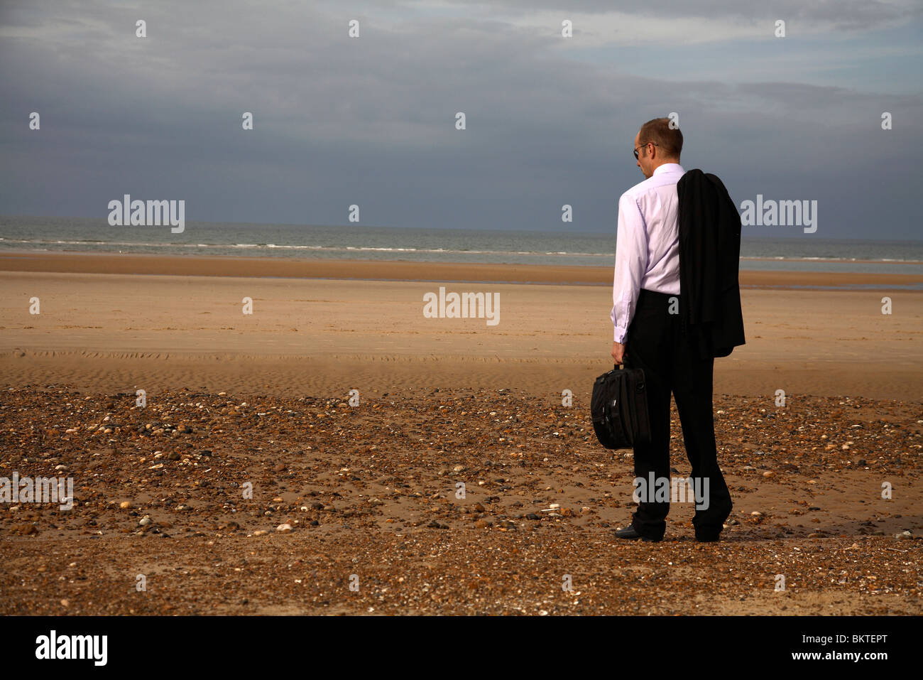 businessman on beach Stock Photo