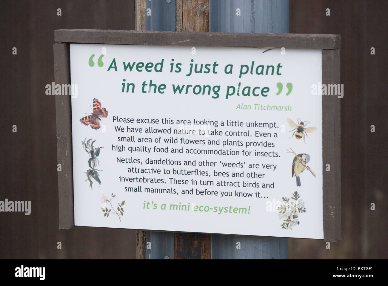 Sign or interpretation graphic, " A Weed is just a plant in the wrong place". Attributed to Alan Titchmarsh. Stock Photo