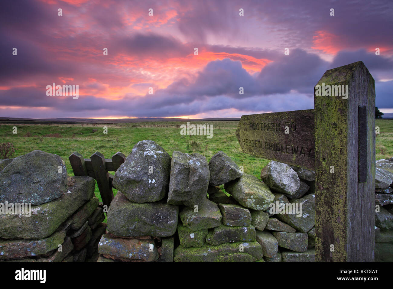 A signpost marks the way toward the Hebden Bridleway near Grassington in the Yorkshire Dales of England Stock Photo