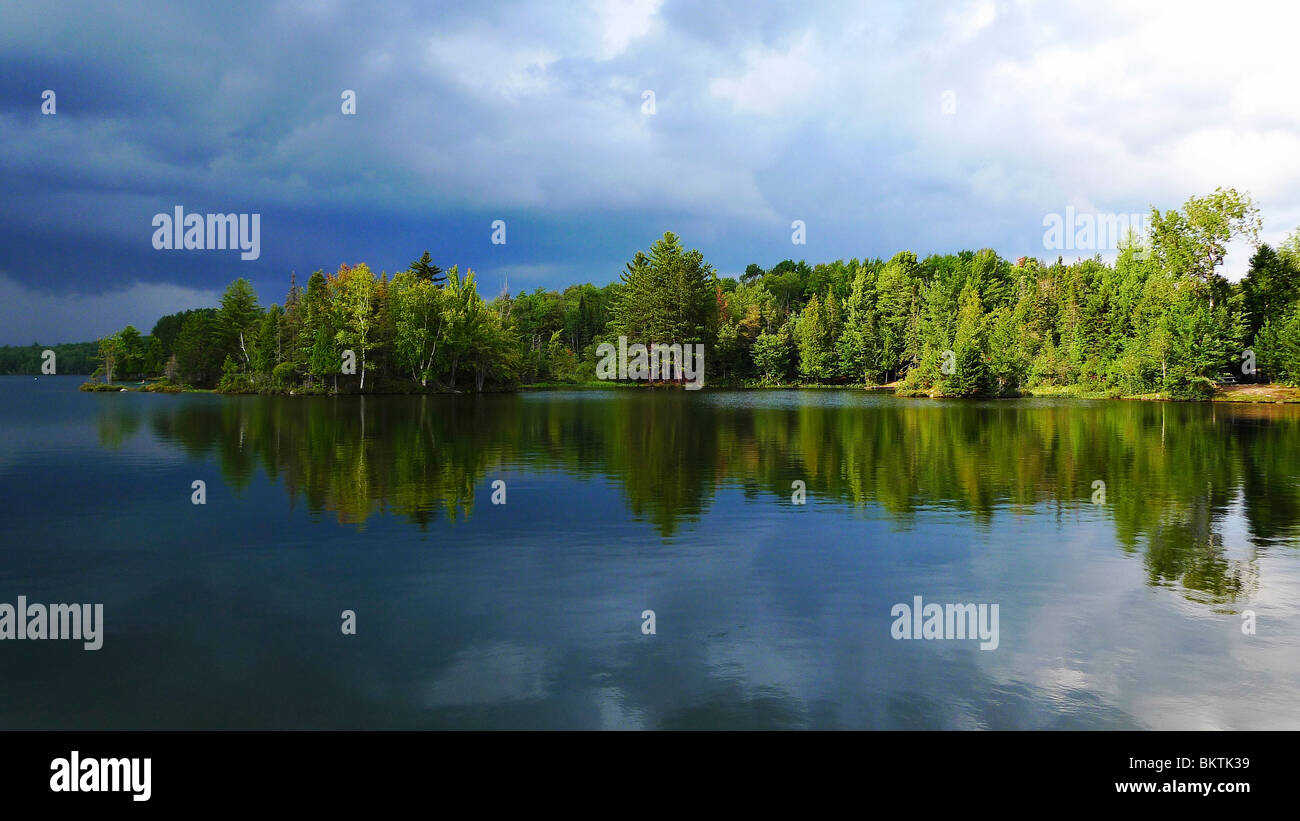 Reflection of a pristine quiet lake. Stock Photo