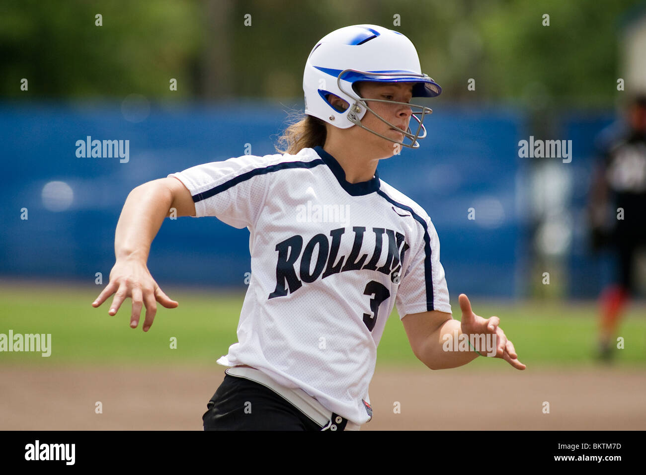 Softball player running to first base Stock Photo Alamy