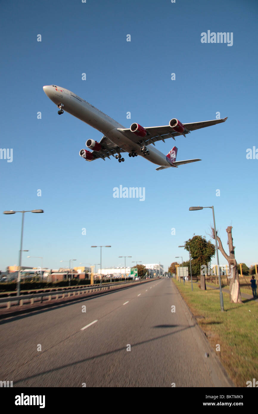 A Virgin Atlantic Airbus A340 landing at Heathrow Airport, London, UK. August 2009 (plane is blurred slightly showing movement) Stock Photo