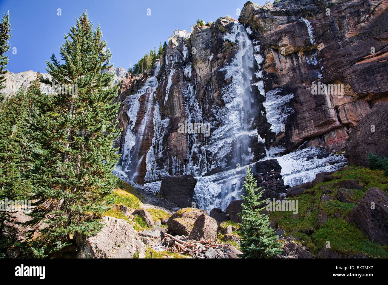 Bridal Veil Falls starts to freeze during late fall in Telluride, Colorado. Stock Photo