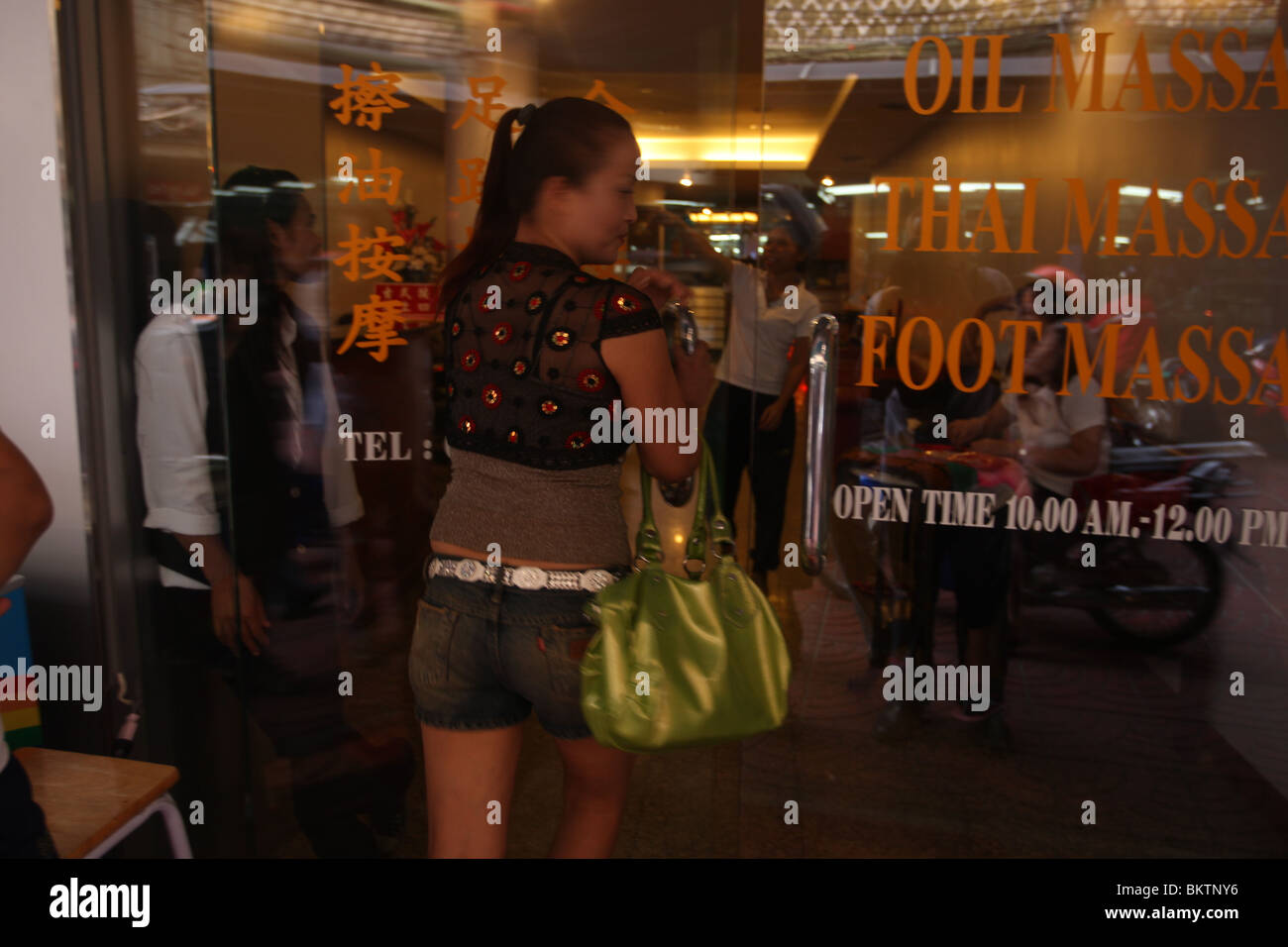 A women walks into a massage parlour in Bangkok's Chinatown Stock Photo -  Alamy