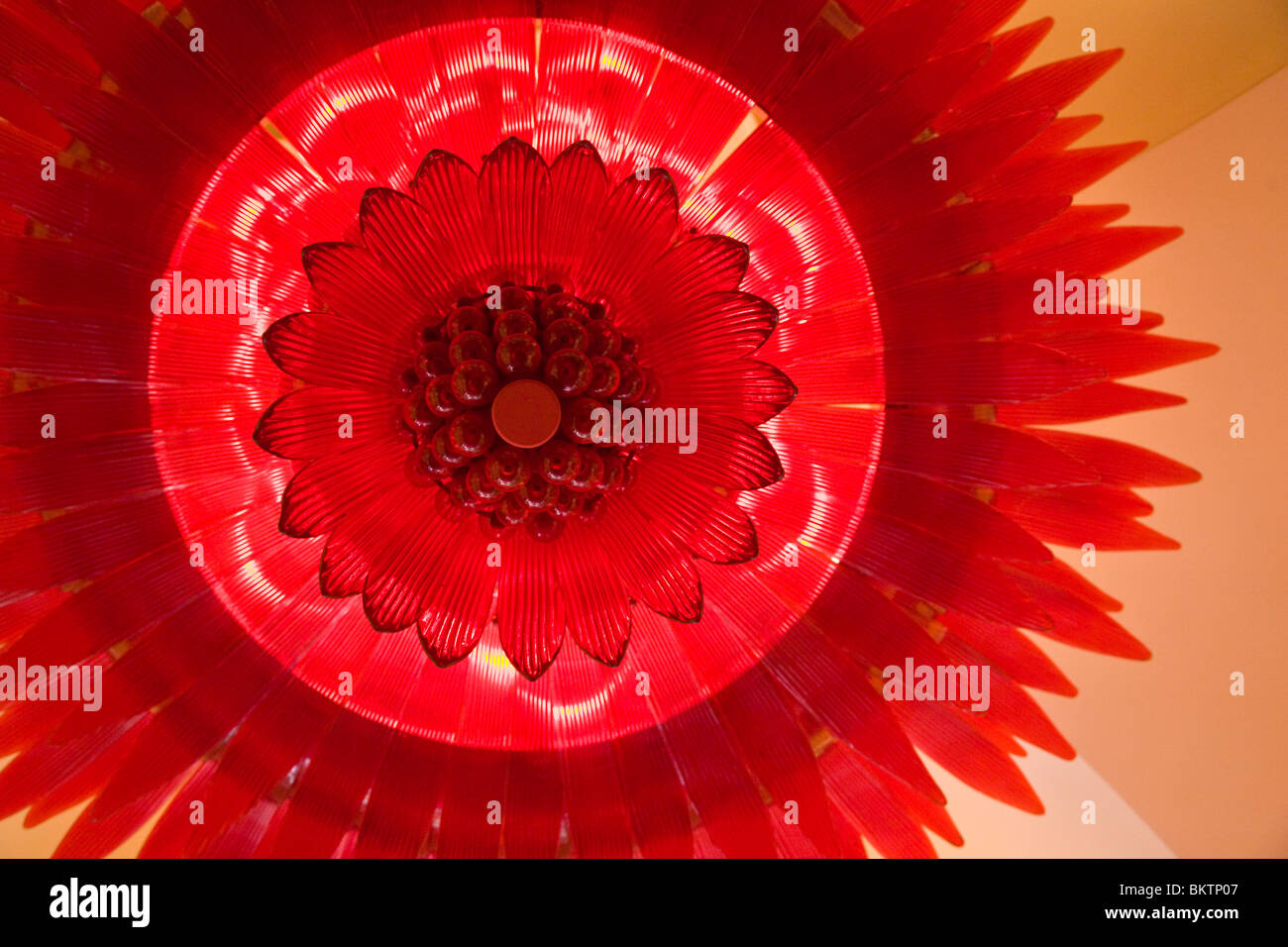 RED LIGHTING fixture inside the ENCORE WYNN HOTEL and CASINO looks like a flower - LAS VEGAS, NEVADA Stock Photo